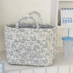 Charcoal floral quilted storage basket with handles and front pocket