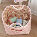Blush pink quilted floral storage basket with handles and roomy interior