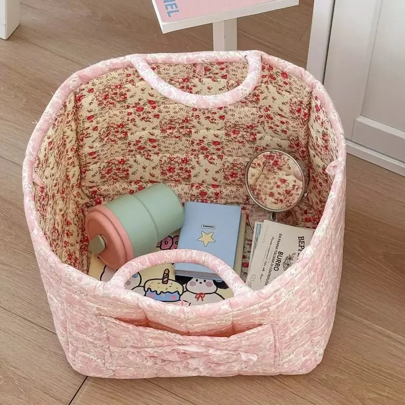 Blush pink quilted floral storage basket with handles and roomy interior