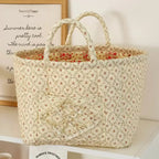 Charcoal floral quilted storage basket with handles and front pocket