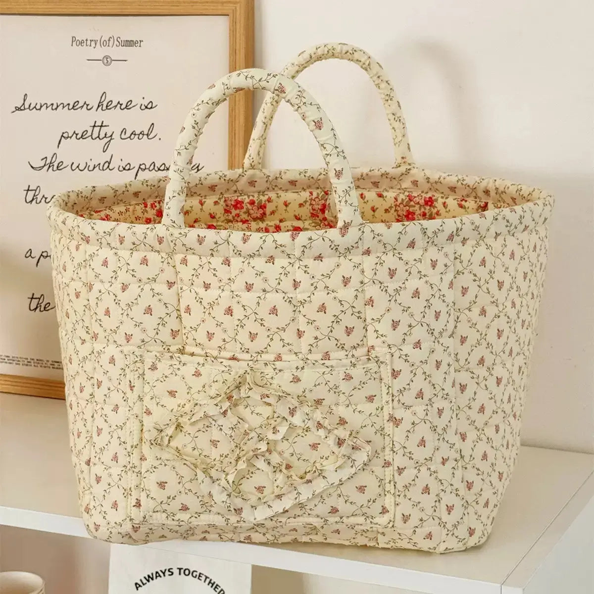 Charcoal floral quilted storage basket with handles and front pocket